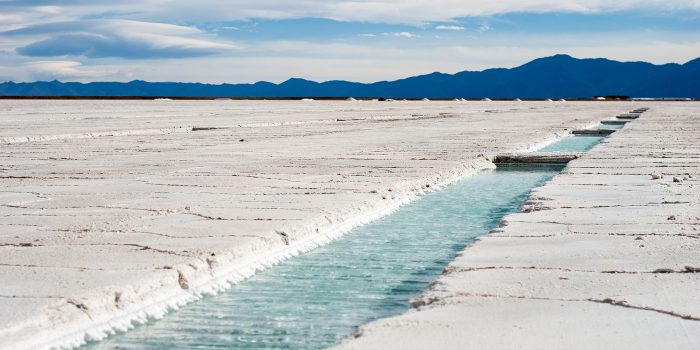 Salinas Grandes in Jujuy, Argentina: Giant white salt lake desert with water channel, wide angled