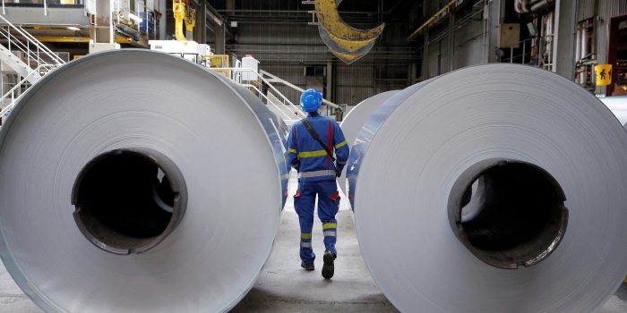 FILE PHOTO: An operator prepares to lift a coil of aluminium with a hoist at the Neuf-Brisach Constellium aluminium products company's production unit in Biesheim, Eastern France, April 9, 2018.  REUTERS/Vincent Kessler//File Photo