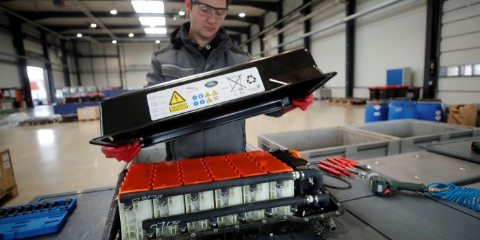 FILE PHOTO: A used Lithium-ion car battery is opened before its dismantling by an employee of the German recycling firm Accurec in Krefeld, Germany, November 16, 2017. Picture taken November 16, 2017. REUTERS/Wolfgang Rattay