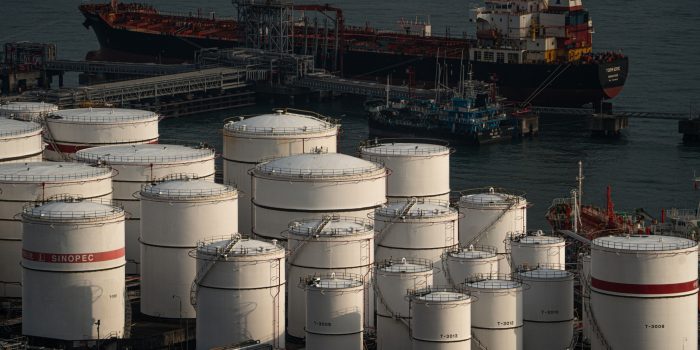 China Petroleum & Chemical Corp. (Sinopec) storage tanks at the container terminal in Hong Kong, China, on Tuesday, Nov. 14, 2023. Oil steadied after a short-lived relief rally as the market digested differing views on the supply and demand outlook, while an industry report pointed to an expansion in US stockpiles. Photographer: Lam Yik/Bloomberg