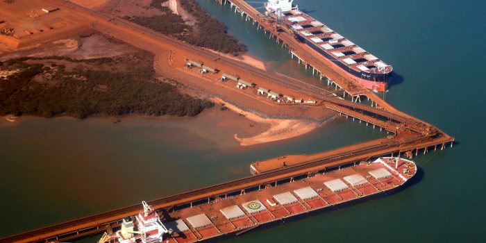 FILE PHOTO: Ships waiting to be loaded with iron ore are seen at the Fortescue loading dock located at Port Hedland, in the Pilbara region of Western Australia December 3, 2013.   REUTERS/David Gray/