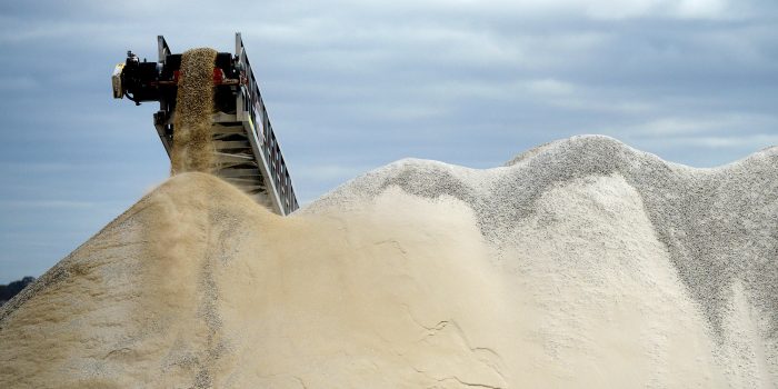 Lithium ore falls from a chute onto a stockpile at the Bald Hill lithium mine site, co-owned by Tawana Resources Ltd. and Alliance Mineral Assets Ltd., outside of Widgiemooltha, Australia, on Monday, Aug. 6, 2018. Australia’s newest lithium exporter Tawana is in talks with potential customers over expansion of its Bald Hill mine and sees no risk of an oversupply that would send prices lower.