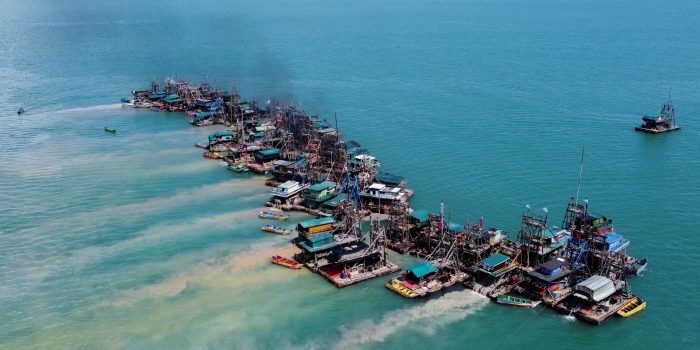 FILE PHOTO: An aerial view shows wooden pontoons equipped to dredge the seabed for deposits of tin ore off the coast of Toboali, on the southern shores of the island of Bangka, Indonesia, May 1, 2021. Picture taken with a drone. REUTERS/Willy Kurniawan/File Photo