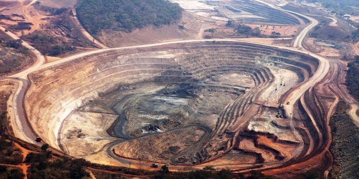 The open pits of the Mutanda copper mine are seen in this aerial view in Katanga province, Democratic Republic of Congo, on Wednesday, Aug. 1, 2012. Israeli billionaire Dan Gertler, whose grandfather co-founded Israel's diamond exchange in 1947, arrived in Congo in 1997 seeking rough diamonds. Since those early days, Gertler has invested in iron ore, gold, cobalt and copper as well as agriculture, oil and banking. Photographer: Simon Dawson/Bloomberg